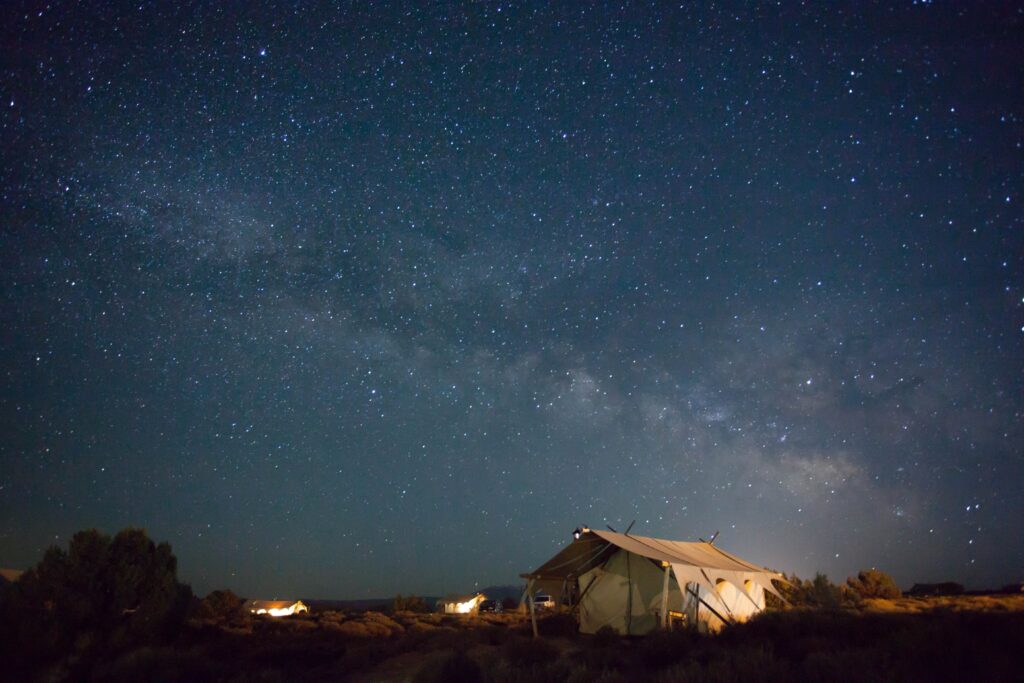 Brown tent under starry sky