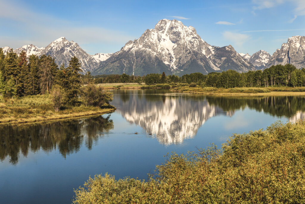 a-view-of-mount-moran-reflecting-in-the-snake
